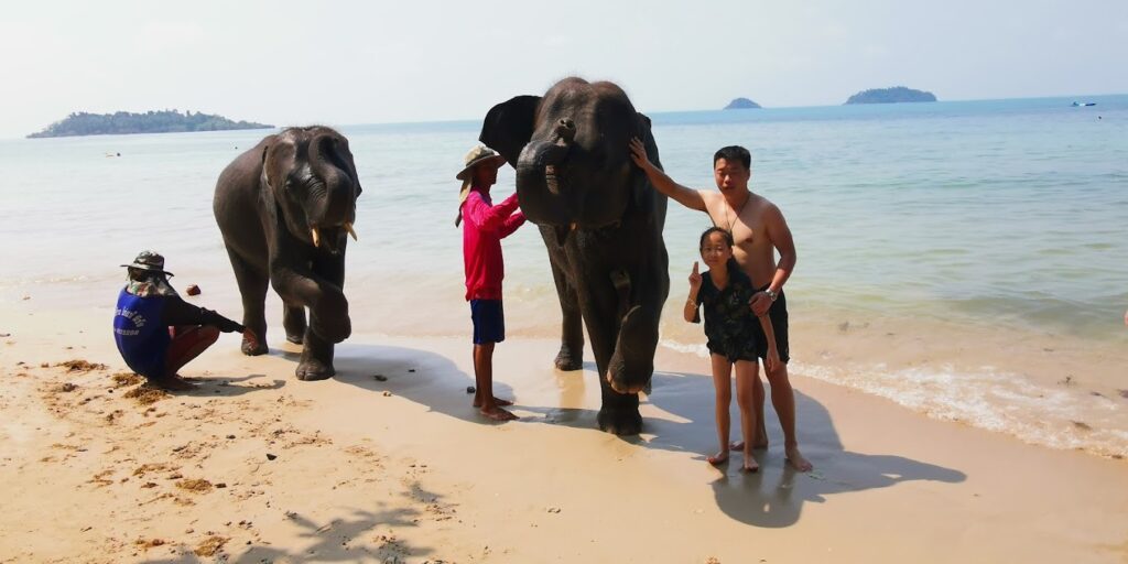 playing water with baby elephant Ko Chang